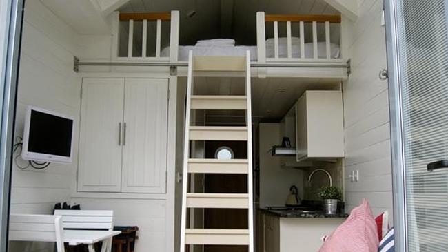 IT’S very cosy inside. That’s the “bedroom’’ up the ladder. Picture: Bradleys Estate Agents.