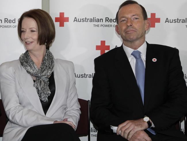 Not what you would call close. Julia Gillard and Tony Abbott at a Red Cross morning tea event at Parliament House in 2012.