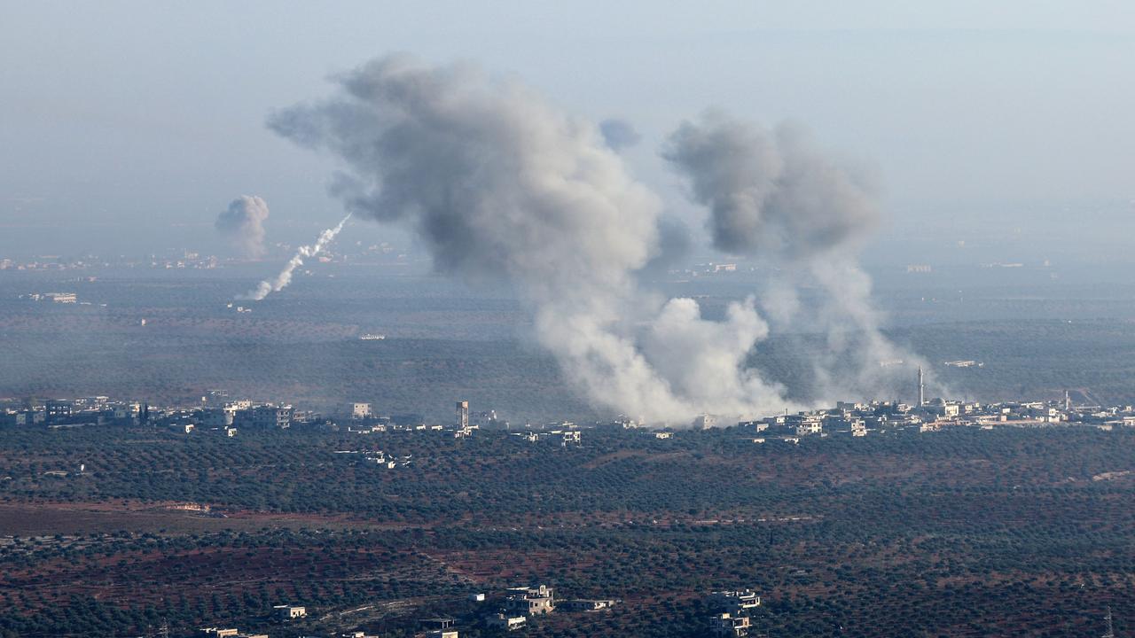 Smoke billows from the site of clashes and mutual shelling between Syrian opposition factions and regime forces on the front lines on the outskirts of the city of Saraqib. Picture: Omar Haj Kadour/AFP