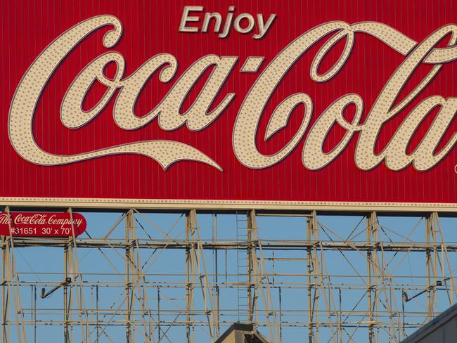 Coca-Cola Co signage is displayed on top of a building on Bryant Street in San Francisco, California, U.S., on Wednesday, Feb. 6, 2013. The Coca-Cola Co. is scheduled to release earnings data on on Feb. 12. Photographer: David Paul Morris/Bloomberg