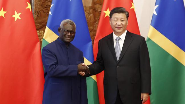 BEIJING, CHINA - OCTOBER 09: Chinese President Xi Jinping (R) shakes hands with Prime Minister Manasseh Damukana Sogavare of the Solomon Islands in Beijing in 2019.