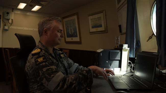 Commander Tony Nagle inside his day quarters onboard the HMAS Perth. Picture: (A)manda Parkinson