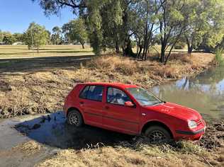 STUCK: A car was found early this morning stuck in Bungil Creek between Charles and Arthur Sts. Picture: Molly Hancock