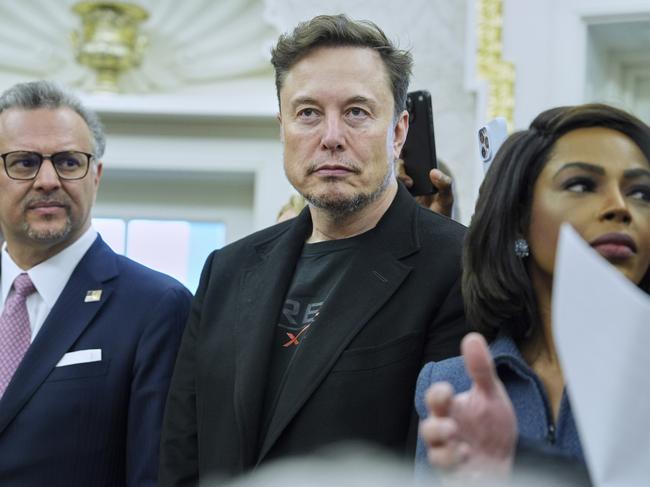 Elon Musk looks on as President Donald Trump meets South African President Cyril Ramaphosa in the Oval Office of the White House, Wednesday, May 21, 2025, in Washington. (AP Photo/Evan Vucci)