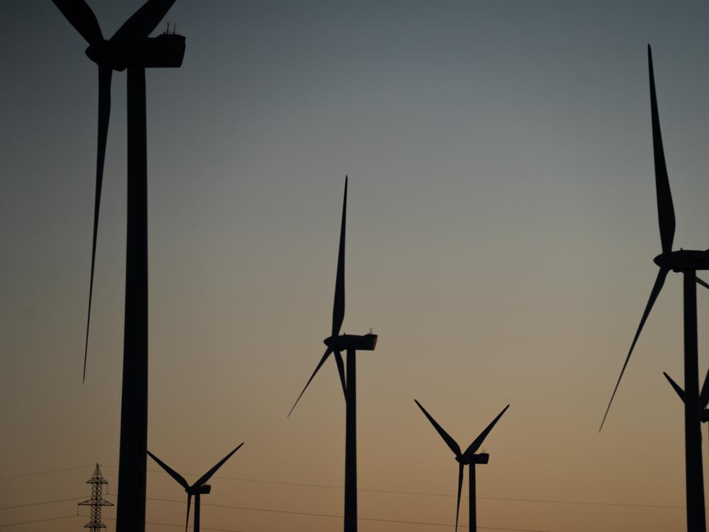 SUVOROVO, BULGARIA - FEBRUARY 04: Wind turbines operate on sunrise at Suvorovo wind farm on February 4, 2022 in Suvorovo, Bulgaria. Due to rising energy prices, several municipalities in the country are switching off electricity in public places from 9:30 pm until 7:00 am. Electricity to consumers and households will not be cut off, but many people in these communities fear the public blackouts will lead to mass thefts and attacks on their homes. To assuage concerns, police and gendarmerie forces are stepping up patrols in these municipalities. Amid a global gas shortage and a looming conflict with Russia, European countries are struggling with a volatile energy market. (Photo by Hristo Rusev/Getty Images)