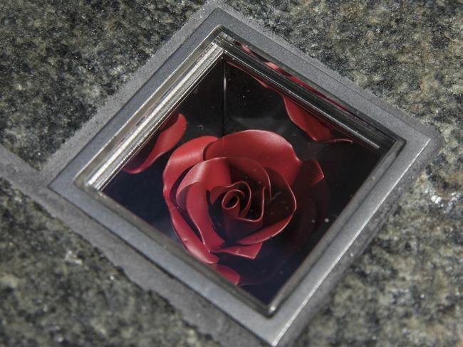 A permanent memorial honouring the lives of Tori Johnson and Katrina Dawson at Martin Place comprises of 210 individual boxes with flowers embedded in the granite pavement. Picture: Jessica Hromas/Getty Images