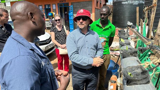 Graham Perrett learns about urban hunger and visits a hydroponics farm growing vegetables in an informal settlement in Nairobi. Picture: Ellen Whinnett