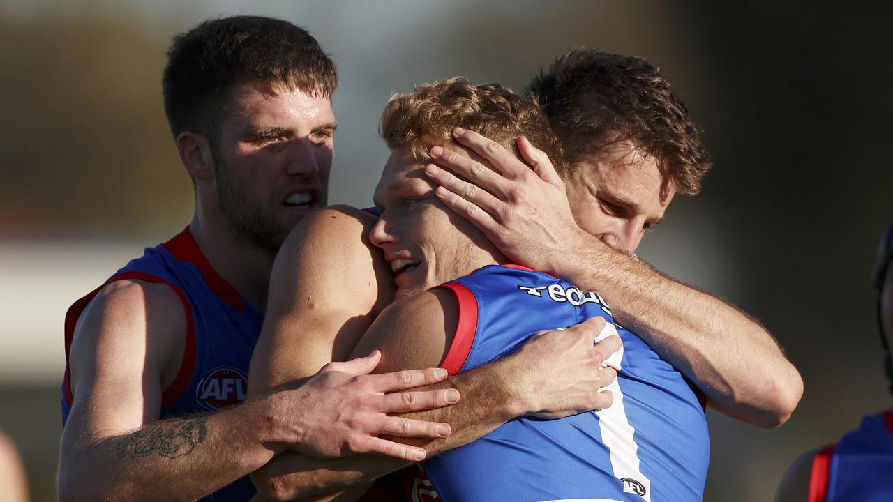 Adam Treloar was swamped by teammates after kicking a goal in his milestone match. Picture: Martin Keep/Getty Images