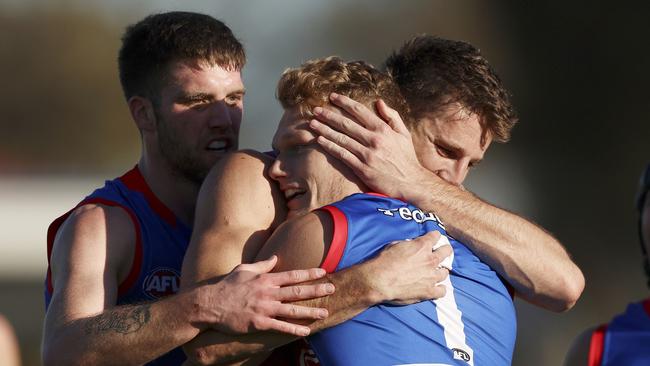 Adam Treloar was swamped by teammates after kicking a goal in his milestone match. Picture: Martin Keep/Getty Images