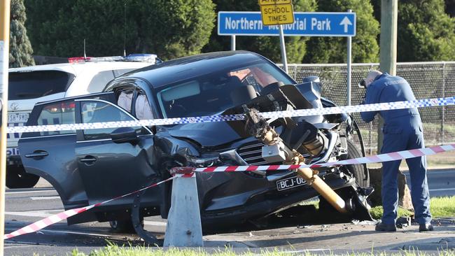 A car, believed to belong to the shooters, crashed on Sydney Rd. Picture: David Crosling