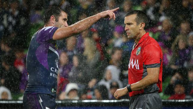 Smith (left) debates an on-field decision with referee Matt Cecchin. Picture: Colleen Petch.