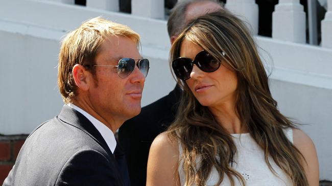 Shane Warne with actress and model Liz Hurley in 2013. Picture: Ian Kington/AFP