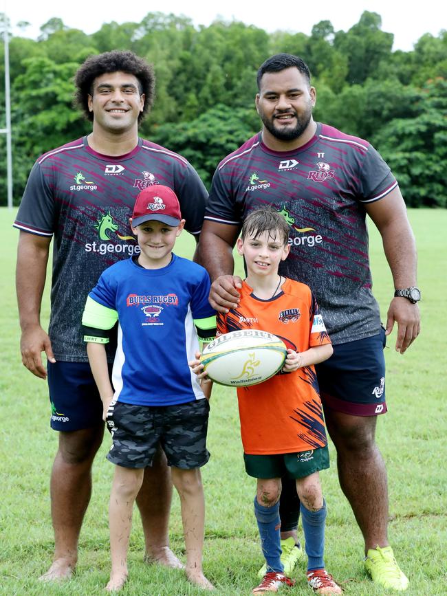 Zane Nonggorr and Taniela Tupou with William Irvine, 9 from Barron Trinity Bulls and Ethan Schnider, 9, from Northern Beaches Mudcrabs. Picture: Stewart McLean