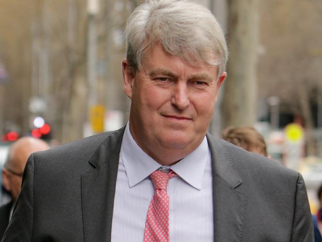 Nicholas Sampson, former headmaster of Geelong Grammar and current head of Cranbrook in Sydney, leaves the County Court in Melbourne during the child abuse Royal Commission hearing.