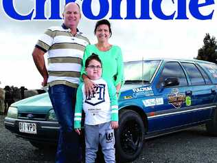 Amanda and Michael Christensen with their son, Cooper in front of their vehicle being entered into the Dunga Derby. Picture: Brendan Bufi