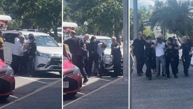 Ezra Austral was restrained by security after evading G4S court security, jumping over the barrier and running down the street at Darwin Local Court on Thursday, May 29. Picture: Zizi Averill