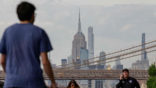 The Empire State Building multiplied by 4700 represents the total weight of the buildings causing New York City to sink. Picture: AFP