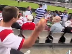 Screen grabs of an NRL  Dragons supporter who purchased a meat pie and threw it at a Bulldog's  supporter at the match. , , Source - Facebook: https://www.facebook.com/watch/?v=3915252775469020, ,