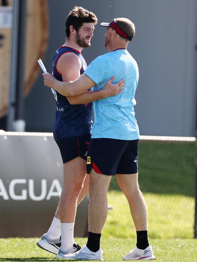 Angus Brayshaw hugs coach Simon Goodwin at training on Tuesday. Picture: Michael Klein