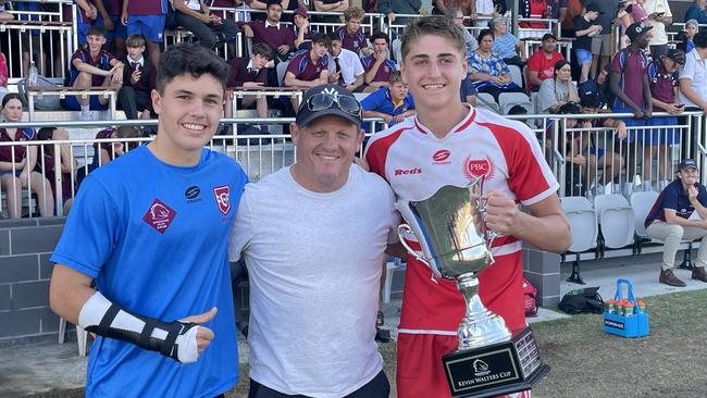 Palm Beach Currumbin players Marley McLaren and Taj lateo with Broncos legend Kevin Walters after the school won the Walters Cup.