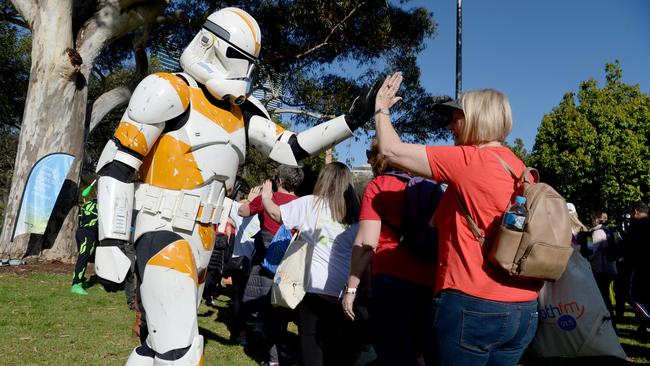 A stormtrooper encourages partipants in Olivia'a Walk for Wellness. Picture: Andrew Henshaw