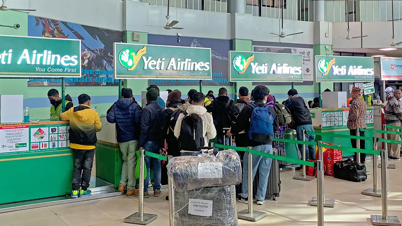 People gather at the Yeti Airlines counter at the airport in Kathmandu on January 15, 2023 following the latest deadly crash. Picture: Prakash Mathema/AFP