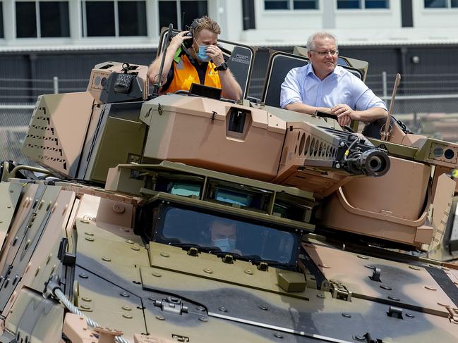 Brisbane, AUSTRALIA - NewsWire Photos October 11, 2020: Prime Minister Scott Morrison rides in a new Australian Boxer CRV at the official opening of the Rheinmetall Military Vehicle Centre of Excellence. The defence technology company in Redbank will create more jobs for Queensland. Picture: NCA NewsWire / Sarah Marshall