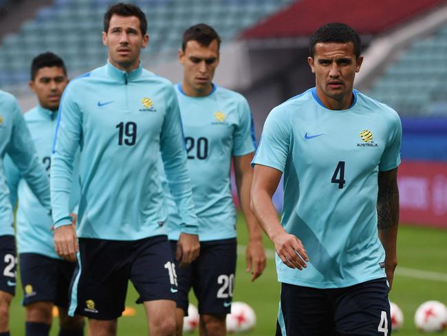 Australia's forward Tim Cahill (C) and teammates attend a training session during the Russia 2017 Confederations Cup football tournament in Sochi on June 18, 2017. / AFP PHOTO / PATRIK STOLLARZ