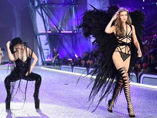 Lady Gaga performs as Gigi Hadid walks the runway during the 2016 Victoria’s Secret Fashion Show on November 30, 2016 in Paris, France. Picture: AFP