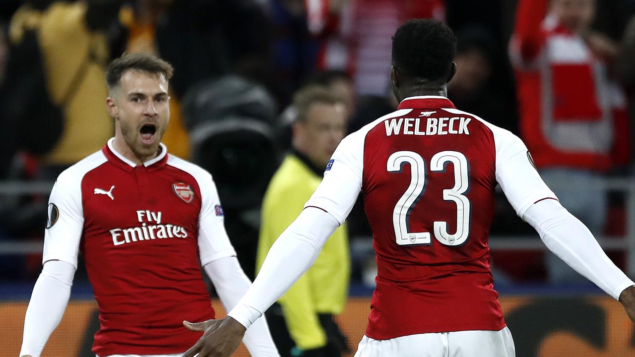 Arsenal's Aaron Ramsey, left, celebrates with Danny Welbeck after scoring his side's second goal