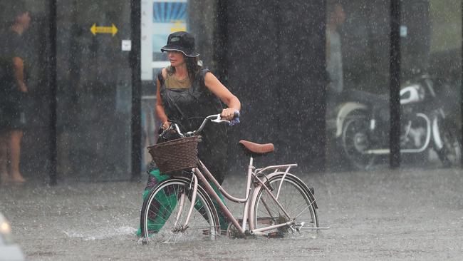 Major flooding in Currumbin Creek Rd at Currumbin. Tough ride home. Picture: Glenn Hampson