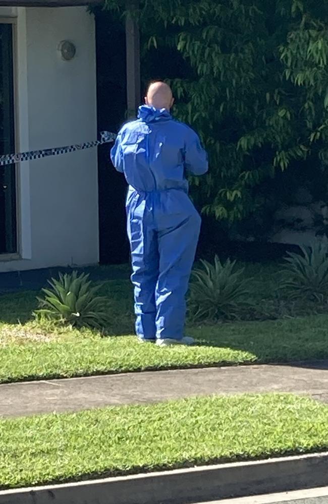 Forensic officers search the scene. Photo: Greg Stolz
