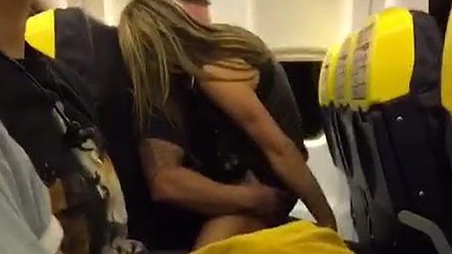 These passengers raised eyebrows after they got frisky an hour into their flight from the UK. Picture: SWNS/Mega