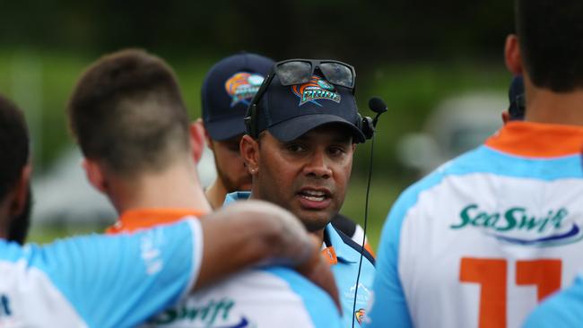 Pride coach Ty Williams talks with his players at half time in the pre season charity trial match between the Northern Pride and the Cairns Foley Shield representative side, held at Petersen Park, Edmonton. PICTURE: BRENDAN RADKE