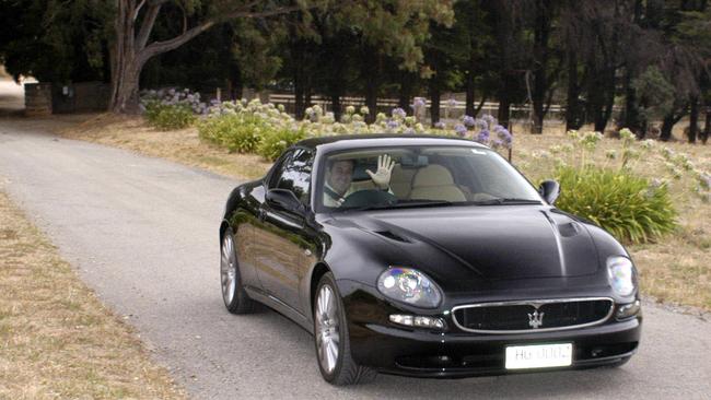 Andrew Garrett travelling from his Springwood park property in his Black Maserati in February 2004. Picture: Ben Searcy