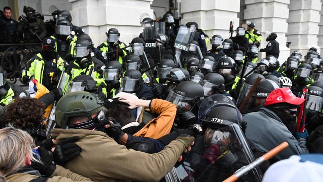 Riot police push back a crowd of supporters of US President Donald Trump after they stormed the Capitol building on January 6.