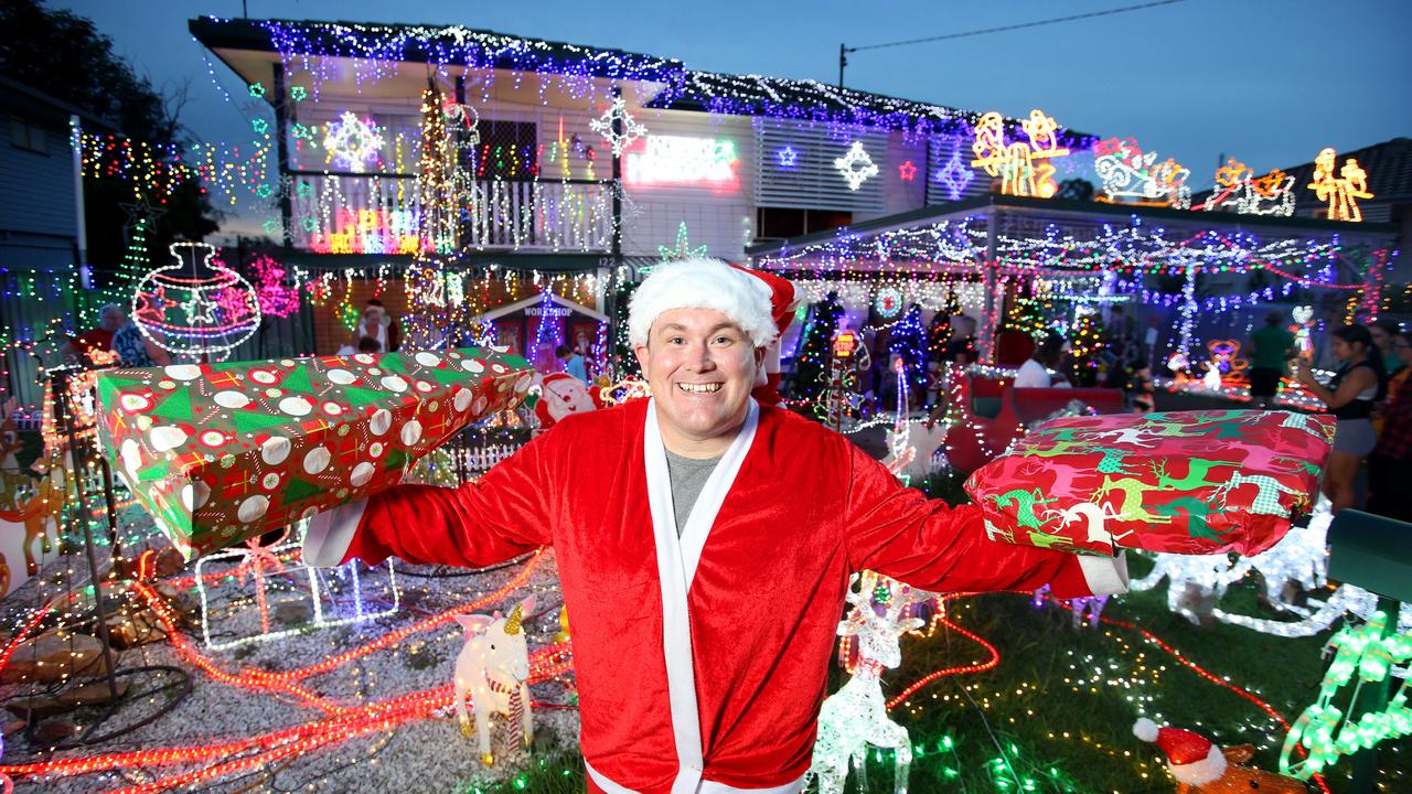 Dan Broxham has been putting Christmas lights on for years, including dressing up as Santa and handing out presents to kids who visit his Bray Park lights display. This year he stepped it up a notch. Picture: Steve Pohlner