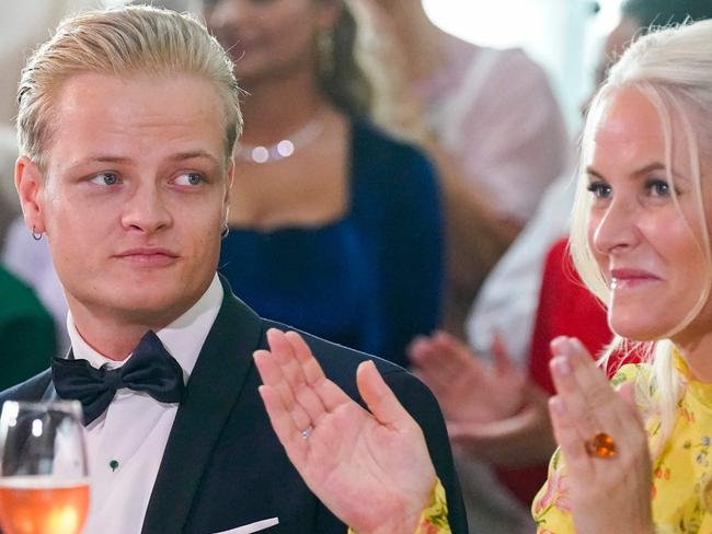 Marius Borg, pictured here sitting next to his mother Norwegian Crown Princess Mette-Marit, was arrested over the weekend. Picture: Lise Ã&#133;serud/NTB/AFP