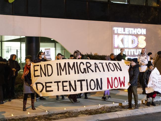 PERTH, AUSTRALIA - JUNE 09:  Members of the public are seen holding signs during a vigil outside the Perth Children's Hospital on June 9, 2021 in Perth, Australia. Three-year-old Tharnicaa, the daughter of the Tamil family from Biloela in Queensland was medically evacuated from detention on Christmas Island to receive medical care in Perth after becoming sick. The family have been detained on Christmas Island since 2019. (Photo by Matt Jelonek/Getty Images)