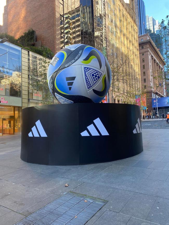 There is a big soccer ball in Martin Place.