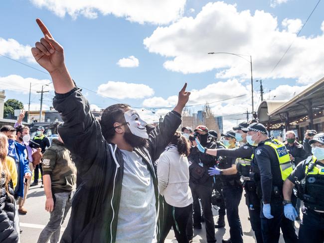 Freedom Day protesters take to Queen Victoria Market. Picture: Jake Nowakowski