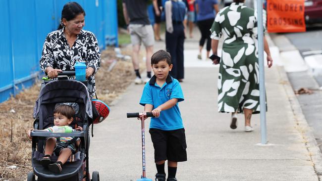 Mum Saray Tek accompanies her son, four-and-a-half-year-old Liverpool West Public School kindergarten student Joseph McAuley, to the newly-opened Gulyangarri Public School. Picture: Rohan Kelly