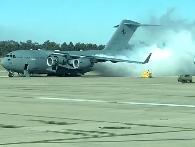 A photo posted to social media about 12.20pm today with a caption describing it as a “C17 on fire at Amberley” showed tall pillars of white smoke billowing in front of an aircraft, with two fire engines parked nearby. A Department of Defence spokeswoman said has confirmed the smoke was expelled from an engine exhaust during routine maintenance.Still from a video. Picture: The Pineapple Express/Facebook