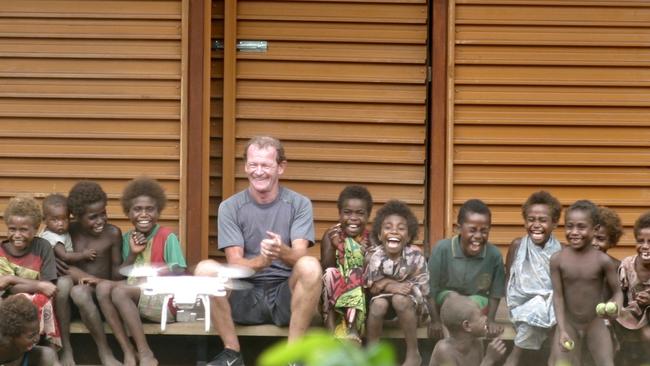 Nev Hyman with a sustainable house he built for those in need overseas.