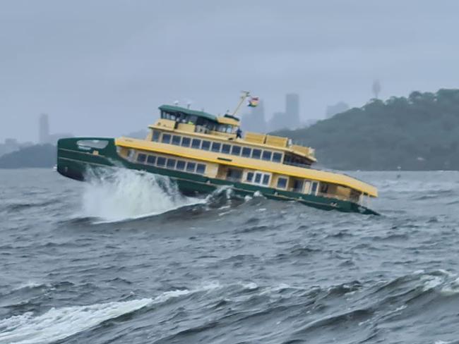 An Emerald Generation 2 ferry, the Fairlight, used on the Manly to Circular Quay route, smashes through huge swells near Sydney Heads during sea trials on Sydney Harbour on Thursday. Picture: Mark Crawley