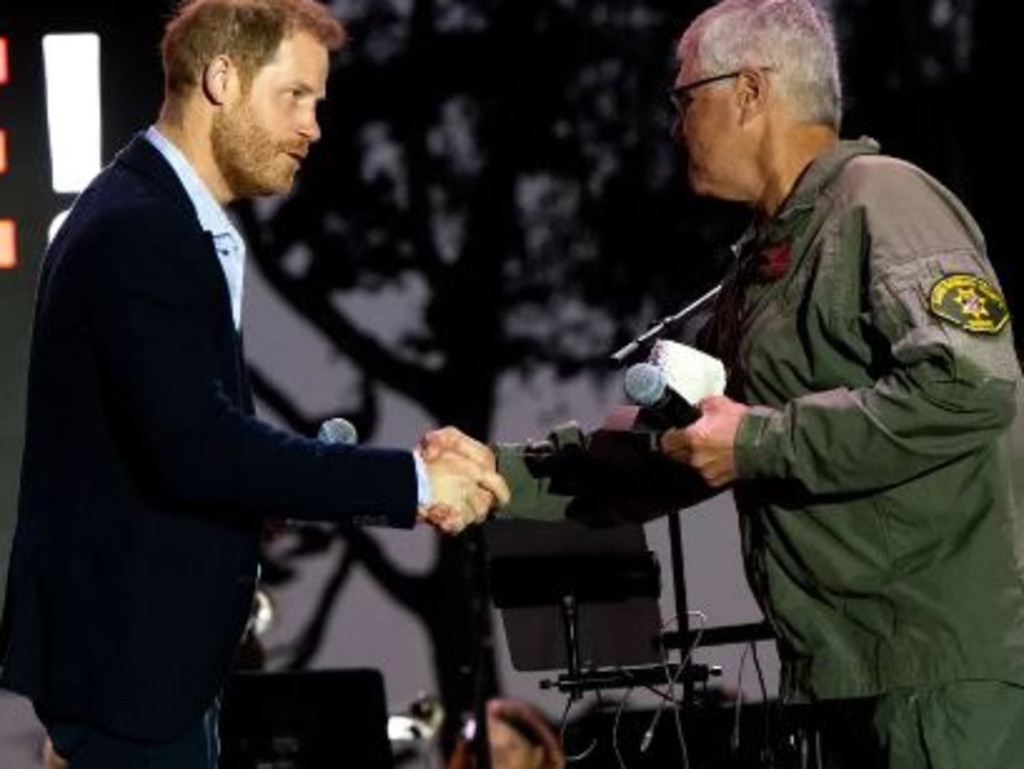 Harry presented an award to Santa Barbara County Sheriff’s Office helicopter pilot Loren Courtney at Kevin Costner’s charity event. Picture: Getty Images