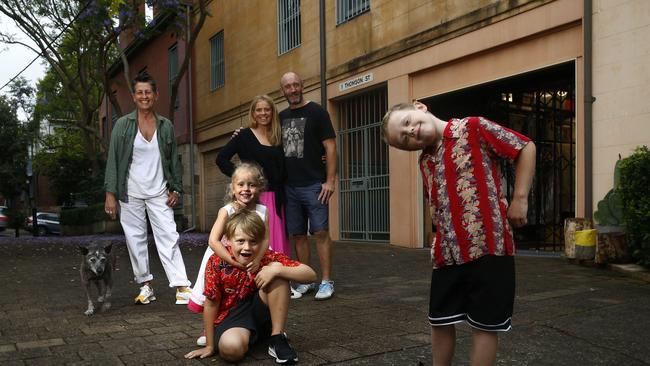 L to R: Michele Morrin with her dog "Fez" and neighbours Lizze- Lamb -3, Rufus Lamb- 8, Emily Lamb, Mike Lamb and Jack Lamb -6 in Thomson street, Darlinghurst. Picture: John Appleyard