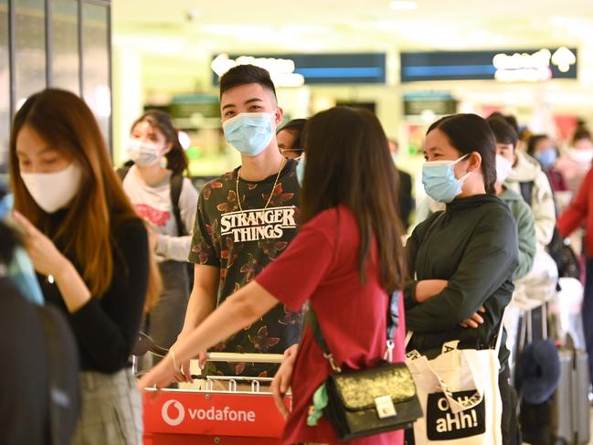 Passengers check in at the departures hall at Sydney’s International Airport. Picture: AAP