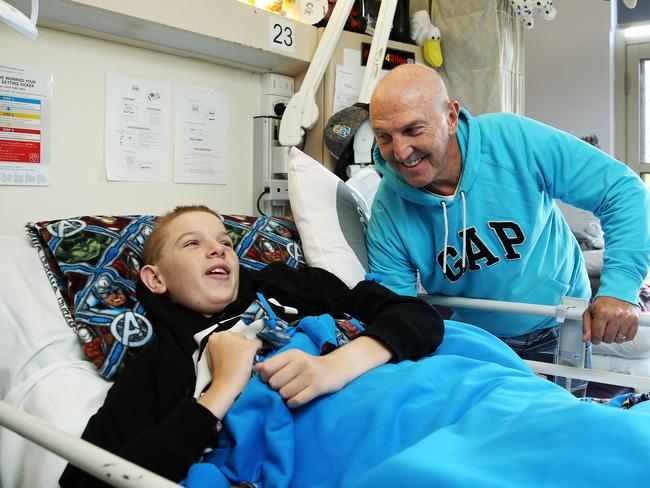 SUNDAY TELEGRAPH - Pictured at Westmead Childrens Hospital today is NRL great Brett Kenny who is having treatment for cancer with his 16 year old stepson Riley is being treated for a spinal injury. Picture: Tim Hunter.