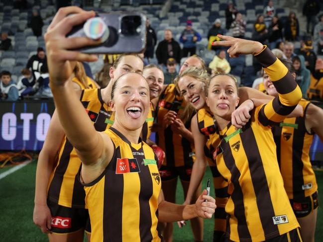 Jasmine Fleming and the Hawks celebrate their win over the Cats. Picture: Daniel Pockett/AFL Photos/via Getty Images.